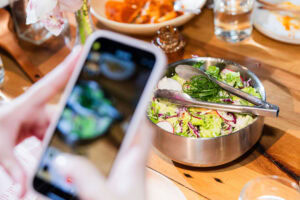 An influencer takes a picture of her meal at the Austin creator meetup