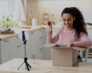 Influencer unboxes a brand product.